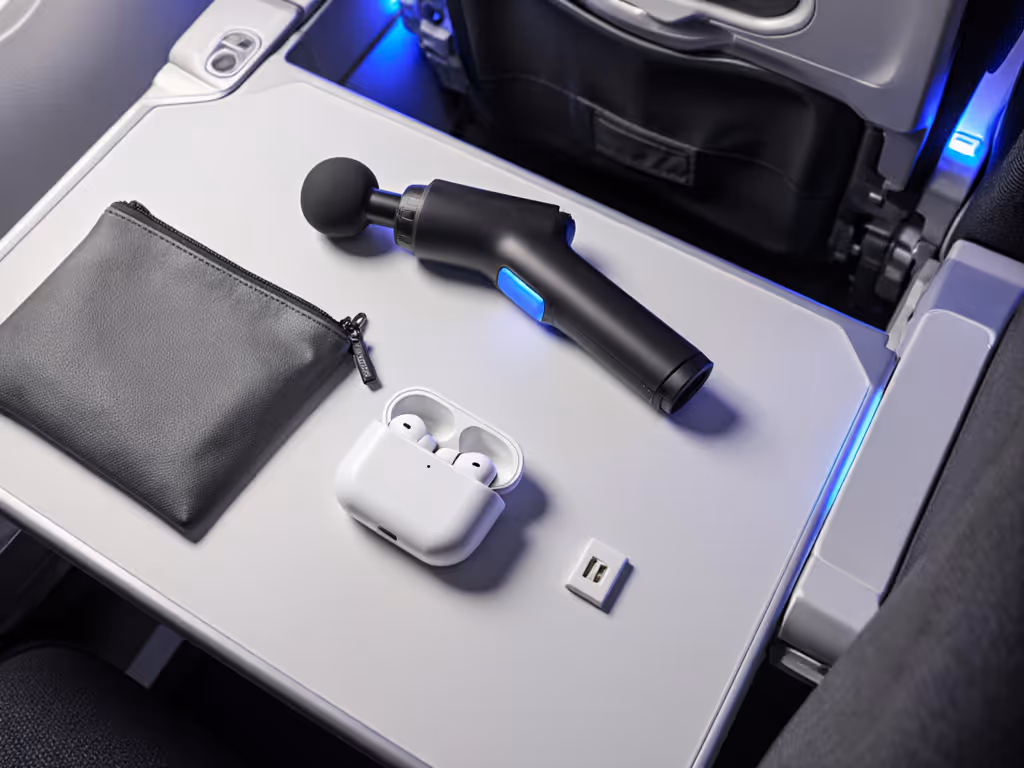 travel-friendly_massage_gun_kit_on_airplane_tray_table